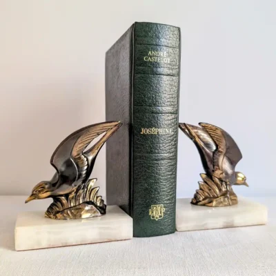 Paire de serre-livres Art déco oiseaux sur socle onyx
