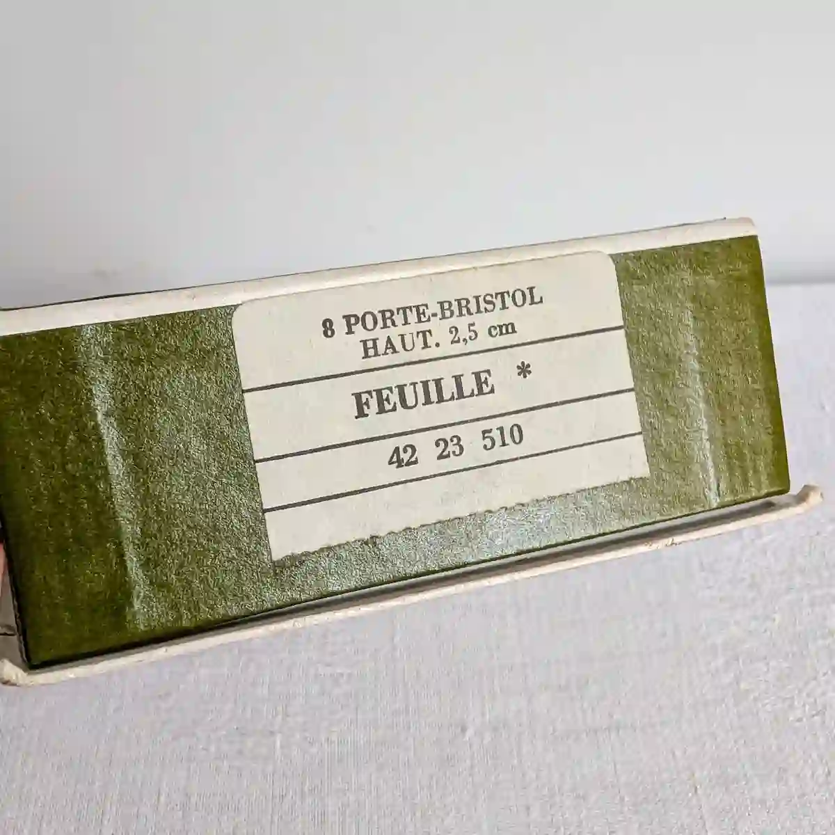 Étiquette d'origine de la boîte Christofle indiquant modèle Feuille référence 42 23 510